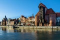 Famous historic Medieval port Crane ÃÂ»uraw / Krantor - one of the GdaÃâsk water gates. Sunny morning on the Motlava River. Old tow Royalty Free Stock Photo